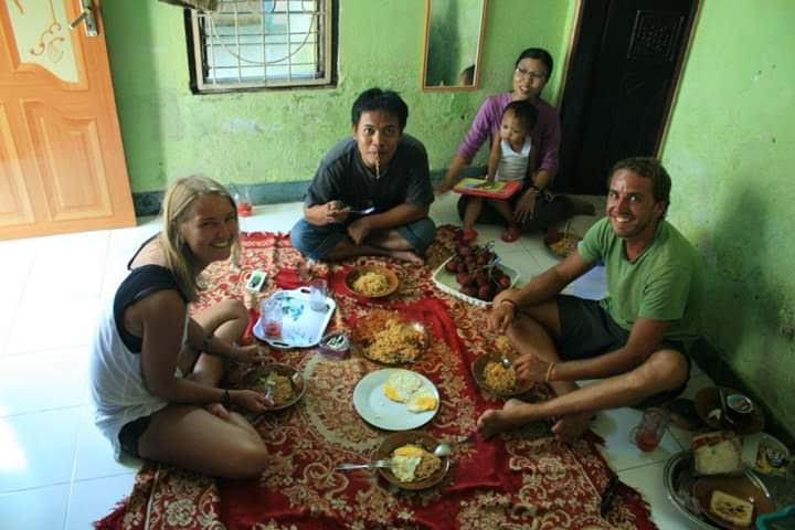 having lunch together with local family